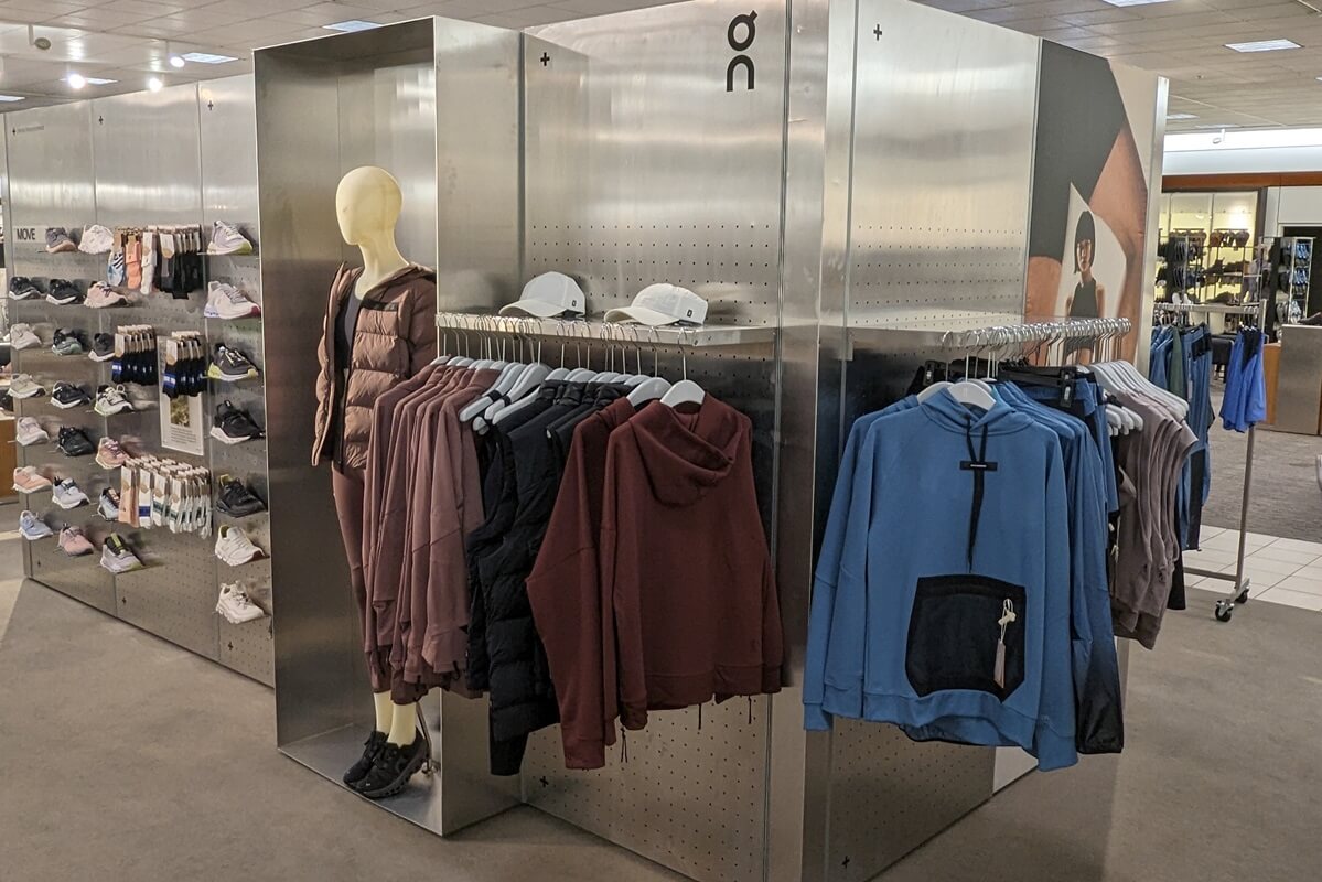 Close up image of ON Running fixture inside a Nordstrom store installed by Nationwide Fixture Installations that displays both woman's and men's apparel.