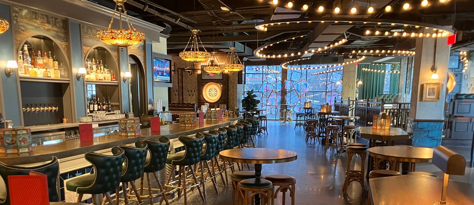 Inside bar and dining area of Flight Club in Atlanta, Georgia with millwork installation completed by Nationwide Fixture Installations