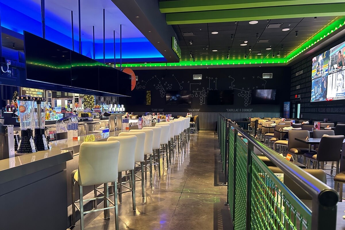 Close up image of bar area at Dave & Busters that was installed by NFI along with other millwork and fixture installation.