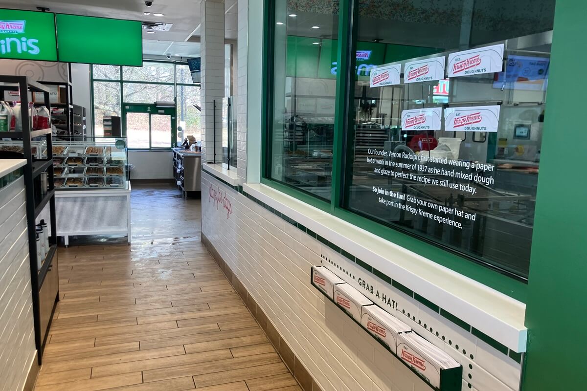 Tile and glass hat wall inside Krispy Kreme located in Atlanta, Georgia. Installation work done by Nationwide FIxture Installations.