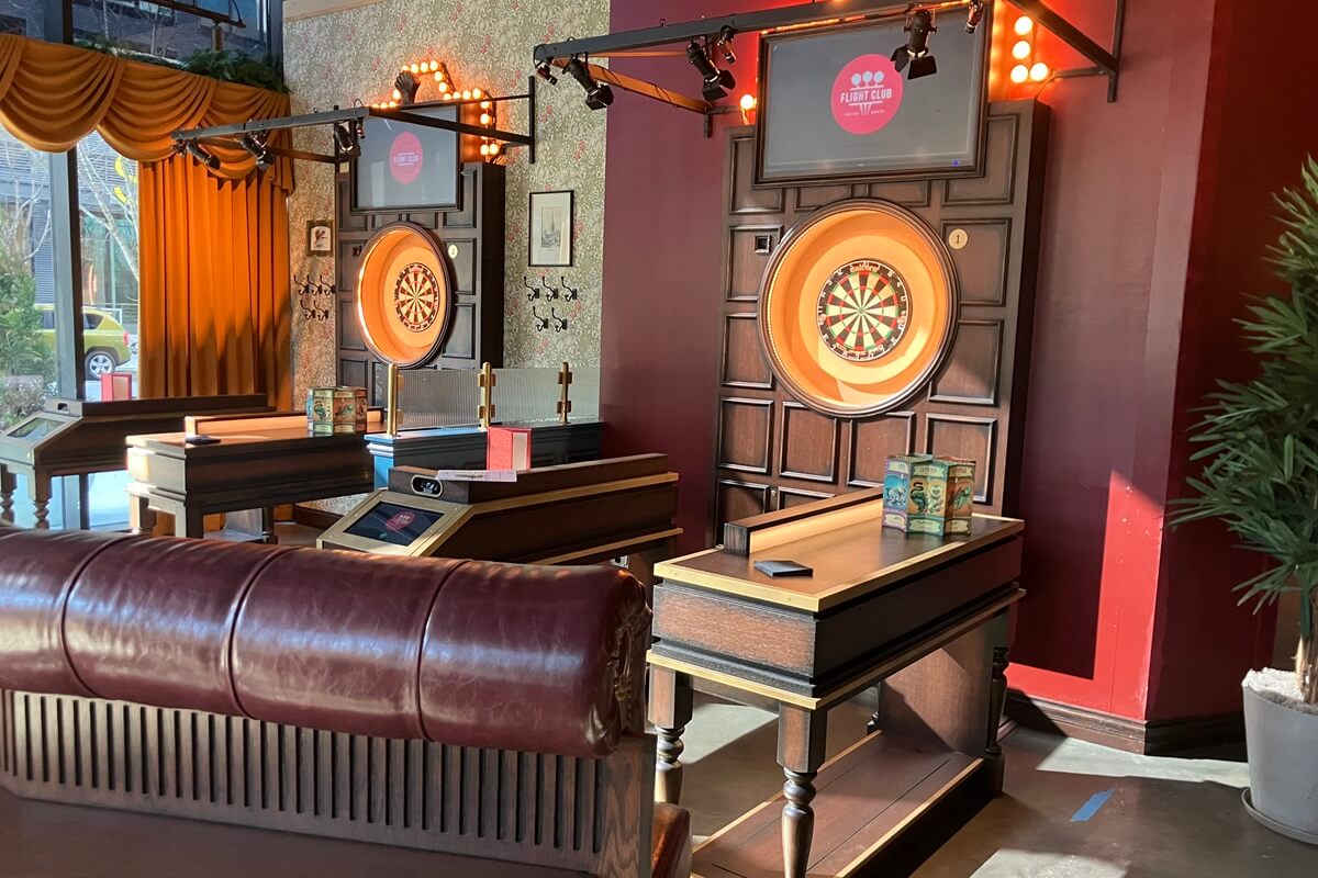 Dart board and sitting area inside of Flight Club located in Atlanta, Georgia. Installation done by Nationwide Fixture Installations.